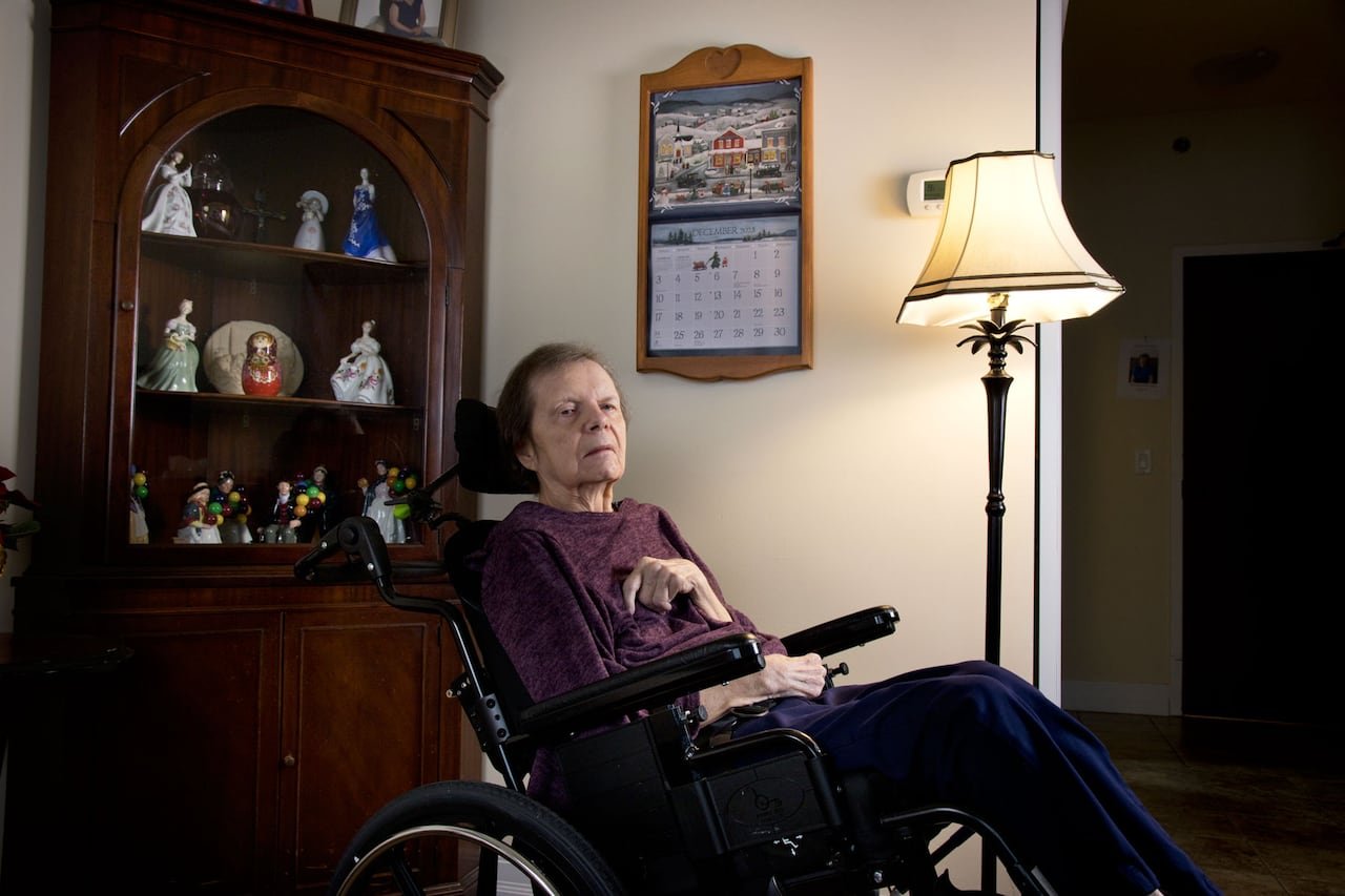 default-185 A woman in a wheelchair in front of a calendar.